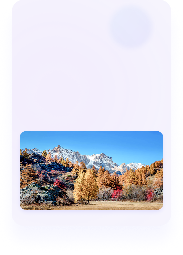 Tingkatkan kejernihan foto dengan PicWish, menampilkan lanskap pegunungan musim gugur yang tajam dengan pepohonan oranye dan puncak bersalju.